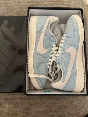 Nike Light Blue Denim Low-Top Sneakers with White Swoosh and Cream Sole